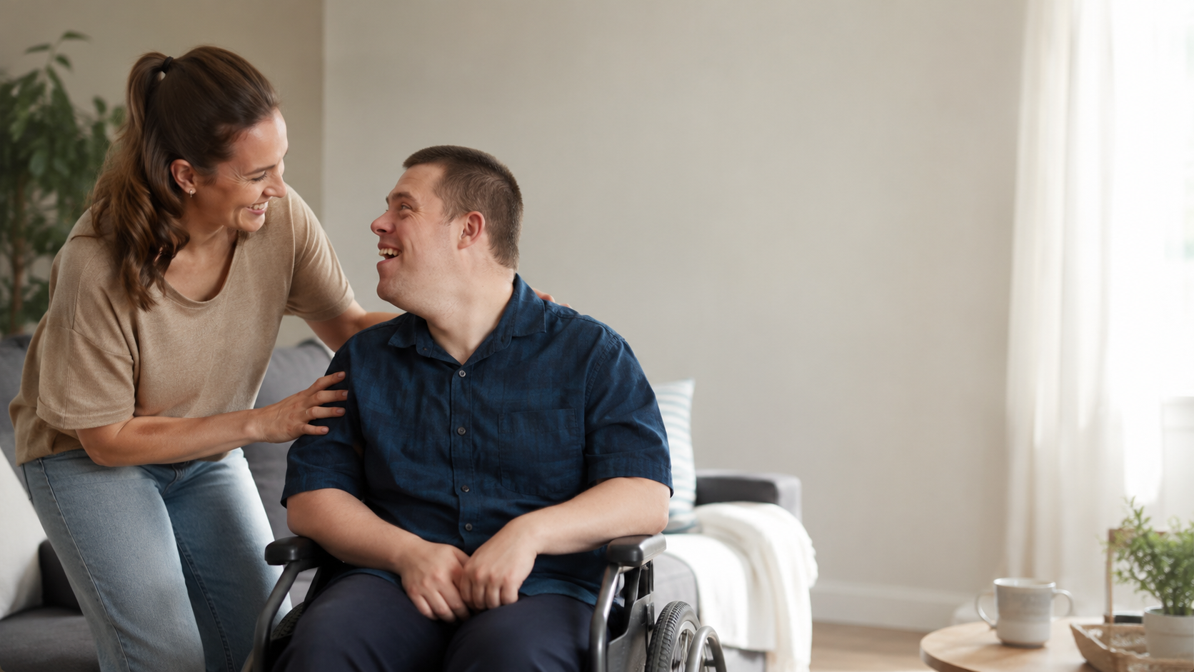 Support specialist and adult with a disability sharing a warm moment at home